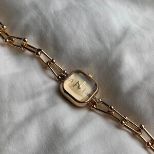 Gold watch with diamond accents